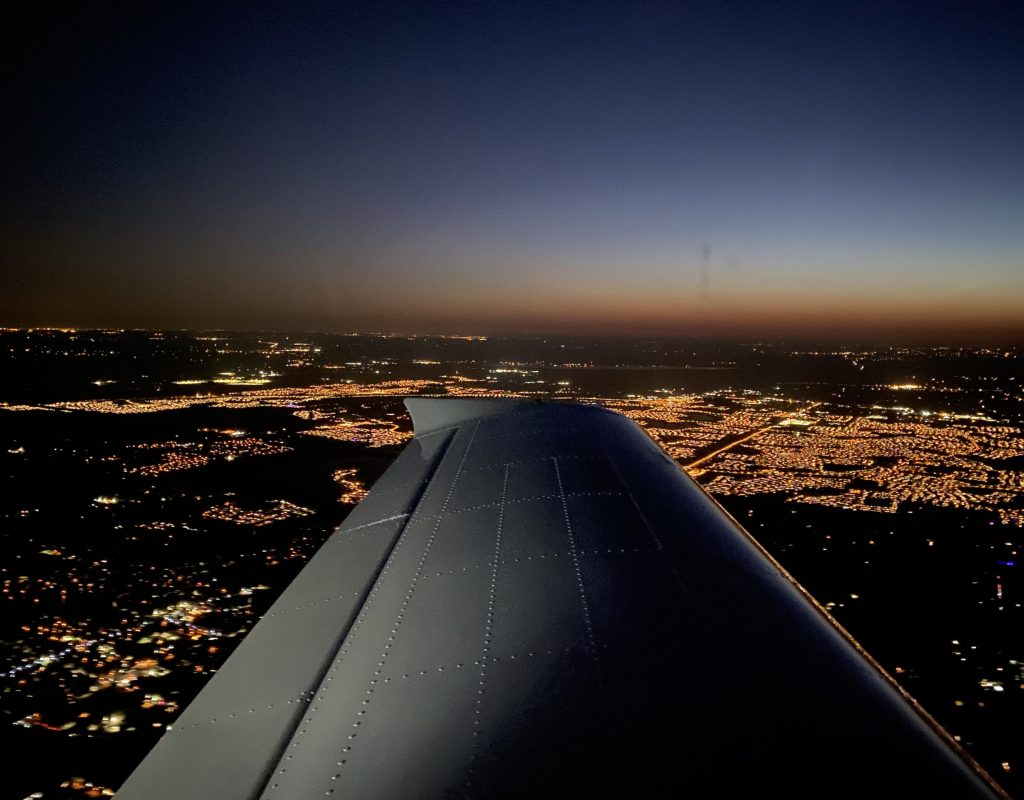 Pilot trainee conducting safety briefing before takeoff during training session