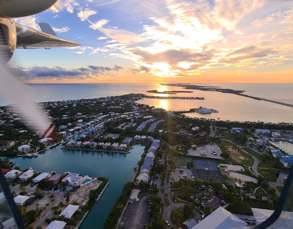 Professional aviation instructor guiding student through landing procedure safely