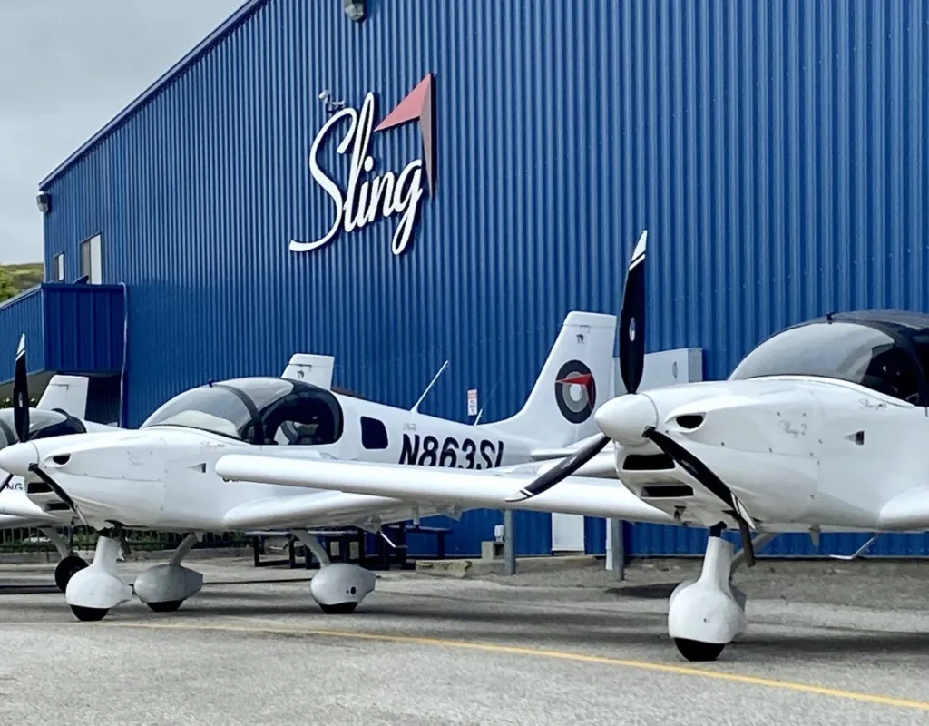 Learner performing aircraft preflight inspection under supervision of instructor
