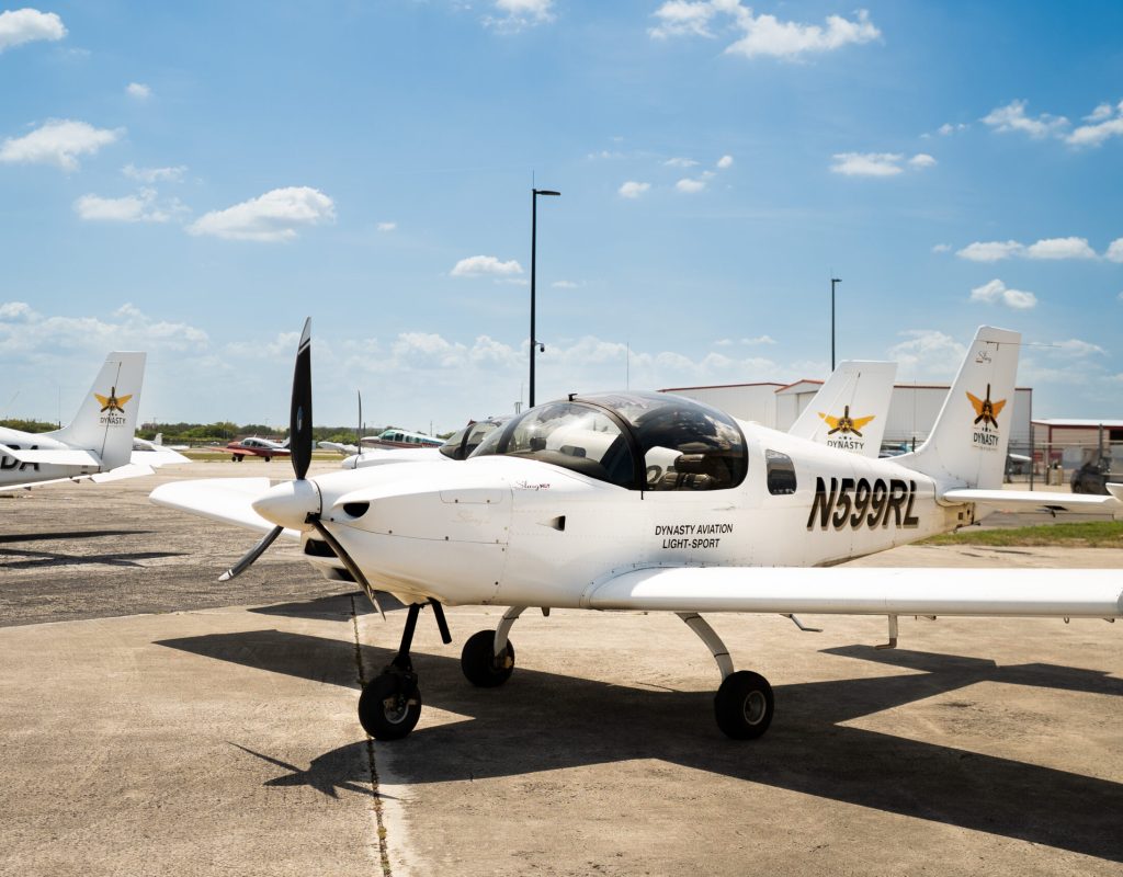 Licensed pilot graduates after training at Dynasty Aviation Inc Pembroke Pines