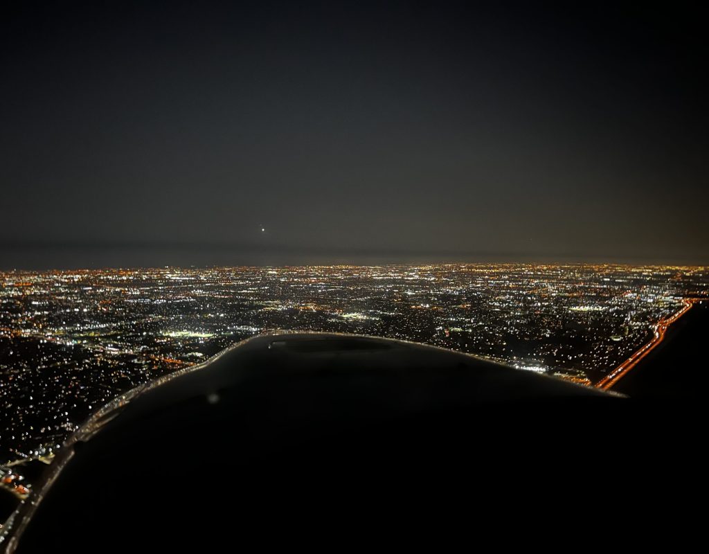 pilot trainees reviewing aviation materials before practice session at Dynasty Aviation Inc
