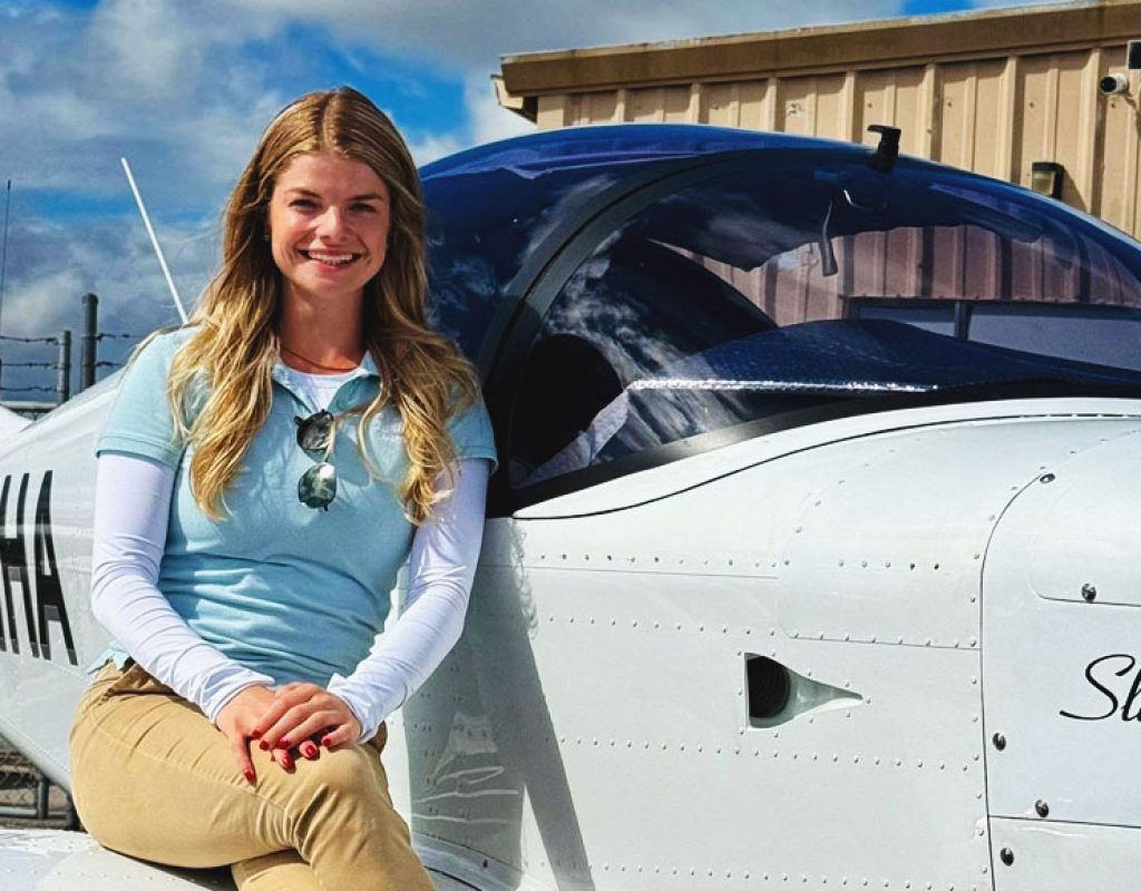 Student performing aircraft checklist with flight instructor before training flight