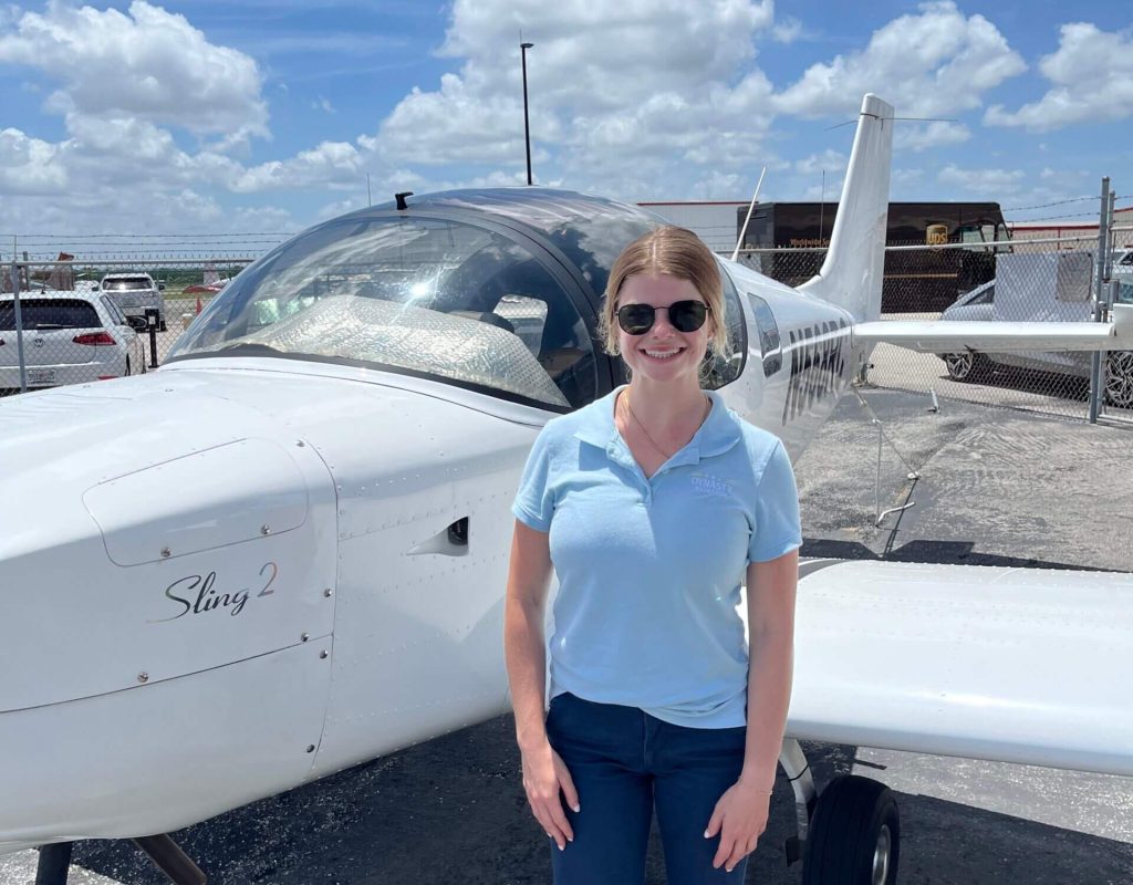 Student pilot completing cockpit lesson in pilot school