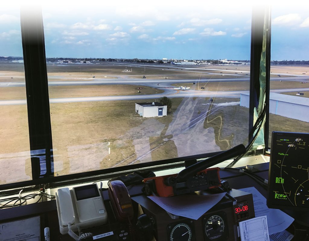 Aviation instructor guiding student through checklist for multi-engine aircraft
