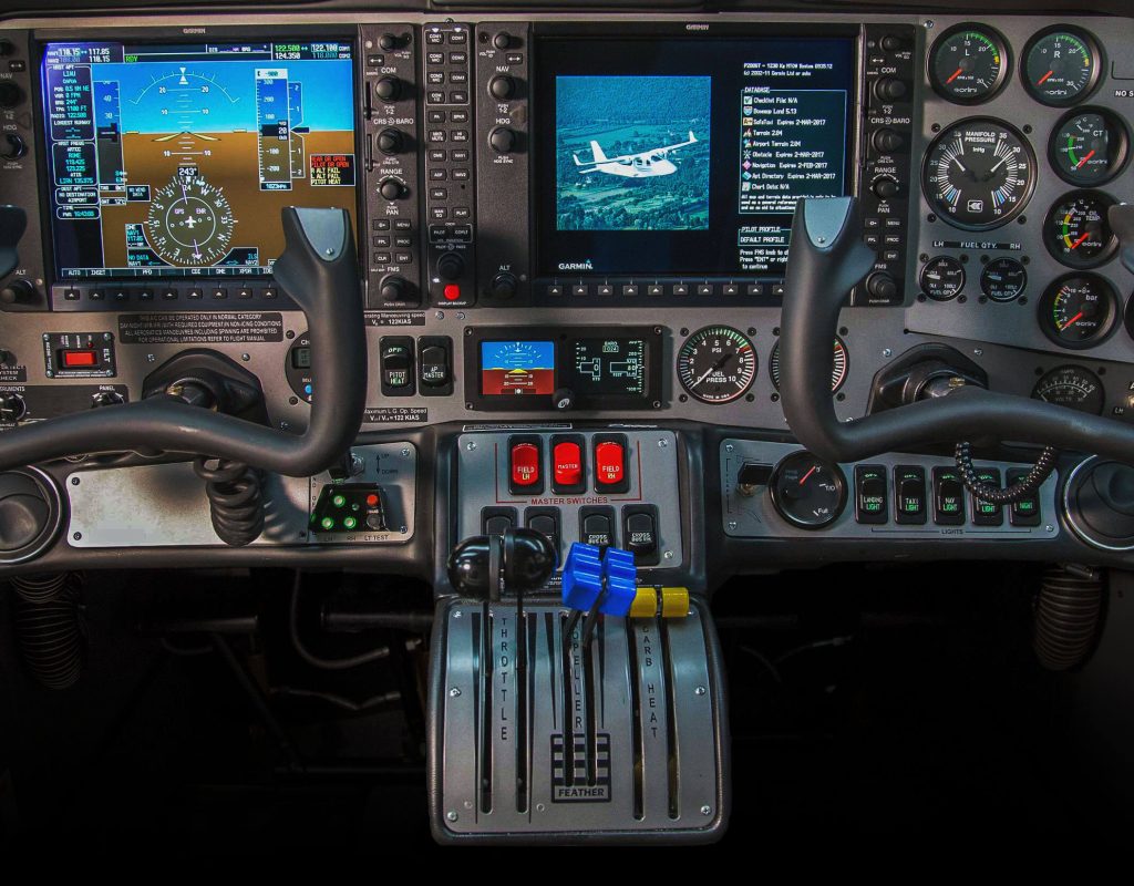 Trainee pilot checking instruments at pilot school